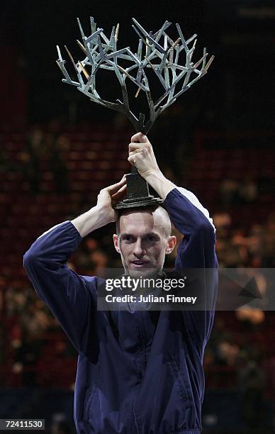 Nikolay Davydenko of Russia celebrates with the trophy after defeating Dominik Hrbaty of Slovakia in the final during day seven of the BNP Paribas...