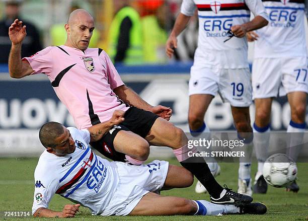 Palermo's midfielder Mark Bresciano of Australia fights for the ball with Sampdoria's defender Angelo Palombo during their Italian Serie A football...