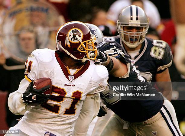 Dallas Cowboys guard Kyle Kosier grabs the facemask of Washington Redskins safety Sean Taylor in fourth quarter action November 5, 2006 at FedExField...