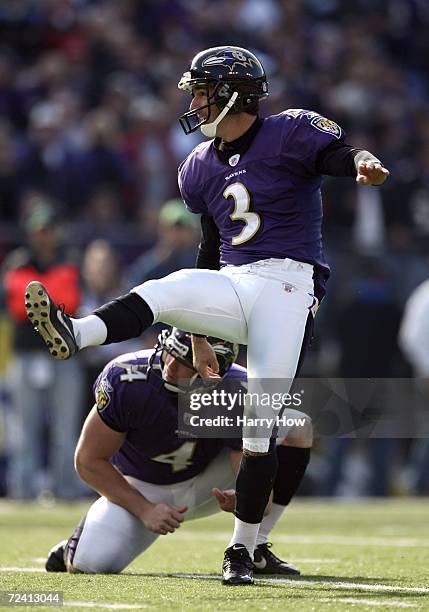 Matt Stover kicks his first of four field goals with Sam Koch against the Cincinnati Bengals during the first quarter on November 5, 2006 at M&T Bank...