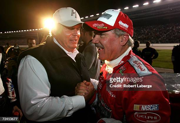 Car owner Rick Hendrick congrulates Terry Labonte, driver of the Kellogg's Chevrolet, after finishing his final racec of his career, following the...