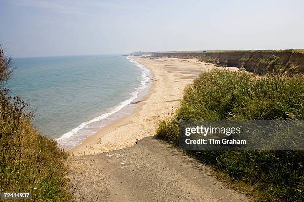 Eroded shoreline road at Happisburgh, Norfolk, United Kingdom.