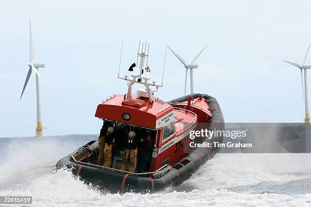 Caister lifeboat and wind turbines of the Caister Wind Farm, Norfolk, United Kingdom.