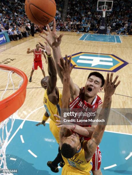 Yao Ming of the Houston Rockets shoots the ball over Tyson Chandler of the New Orleans/Oklahoma City Hornets on November 5, 2006 at the New Orleans...