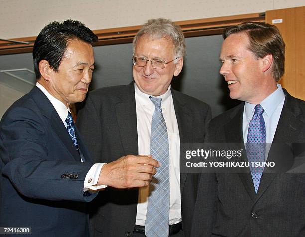 Under secretaries of state, Nicholas Burns and Robert Joseph , are greeted by Japanese Foreign Minister Taro Aso for their talks at Aso's office in...