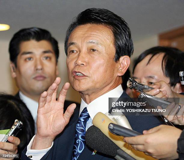 Japanese Foreign Minister Taro Aso speaks to reporters after meeting with US under secretaries of state, Nicholas Burns and Robert Joseph, at his...
