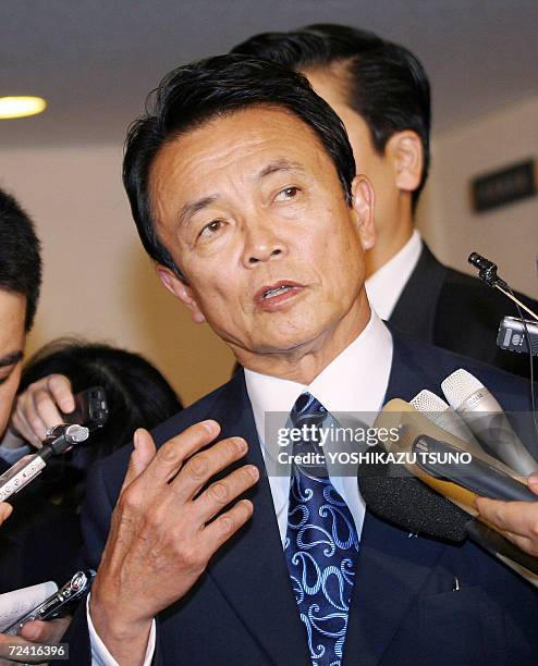 Japanese Foreign Minister Taro Aso speaks to reporters after meeting with US under secretaries of state, Nicholas Burns and Robert Joseph, at his...