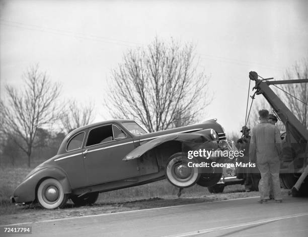 tow truck lifting broken car, (b&w) - 1950's cars stock pictures, royalty-free photos & images