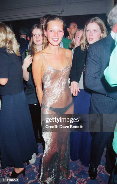 English supermodel Kate Moss wearing a diaphanous silver dress at the Elite Model Agency party for the Look of the Year Contest at the Hilton Hotel,...