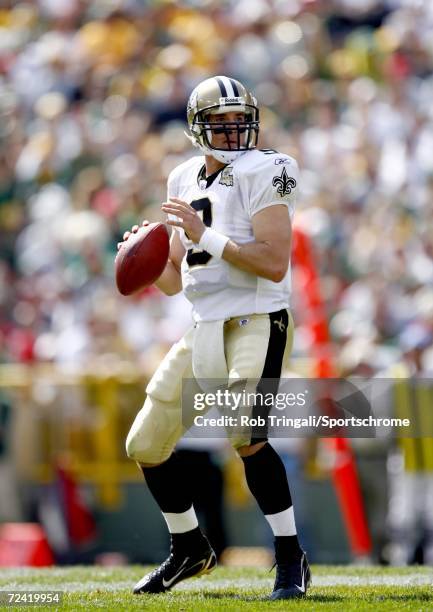 Quarterback Drew Brees of the New Orleans Saints passes against the Green Bay Packers on September 17, 2006 at Lambeau Field in Green Bay, Wisconsin....