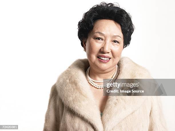 woman wearing a fur coat - fashion glamour pearl stock pictures, royalty-free photos & images