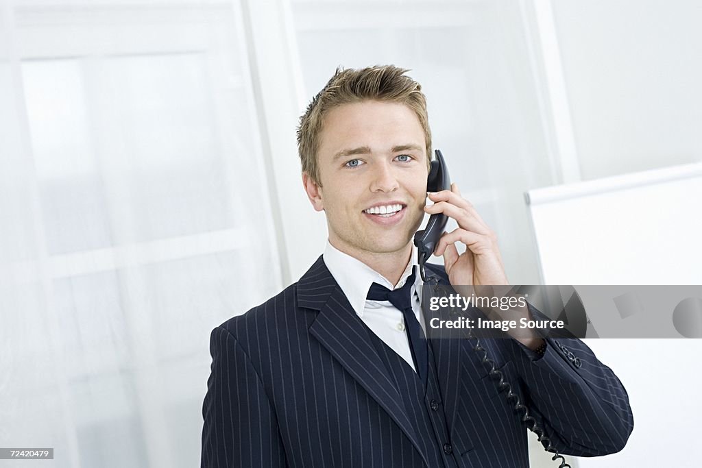 Young businessman on the telephone