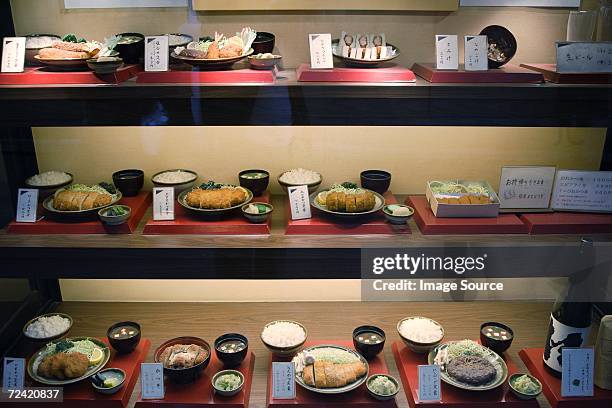 window display of a japanese restaurant - tonkatsu stock pictures, royalty-free photos & images