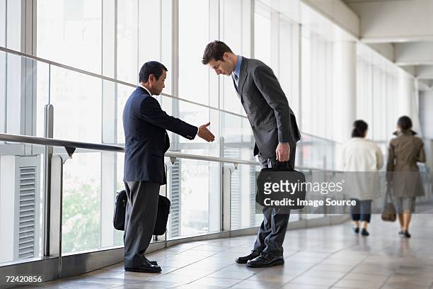 businessmen greeting - cultures stock pictures, royalty-free photos & images