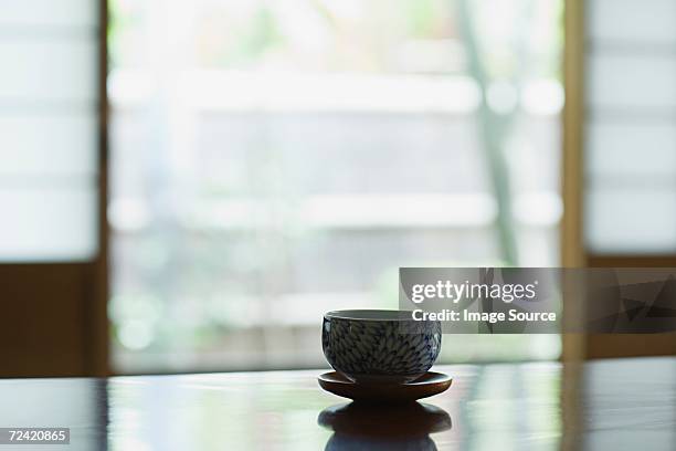 tea bowl on a table - japanese tea cup stock pictures, royalty-free photos & images
