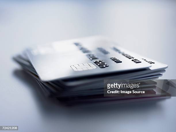pile of credit cards - credit card and stapel stockfoto's en -beelden