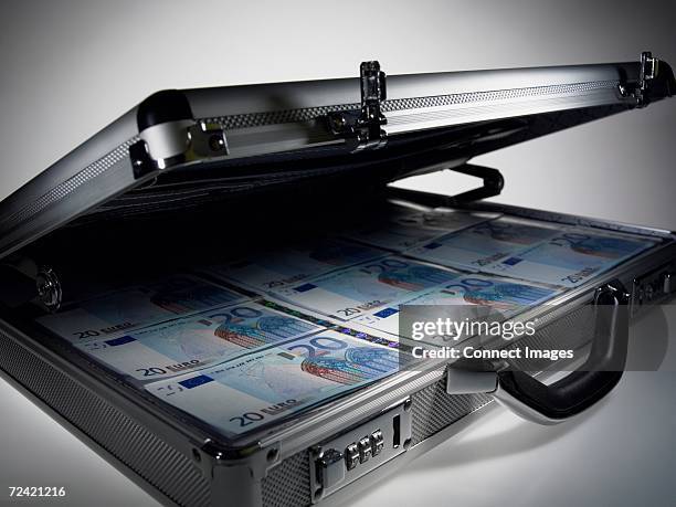 briefcase full of twenty euro notes - briefcase stock pictures, royalty-free photos & images