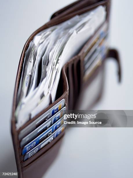 wallet full of cards and receipts - full wallet stock pictures, royalty-free photos & images