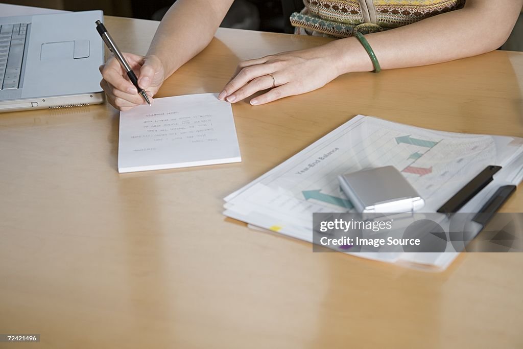 Businesswoman writing