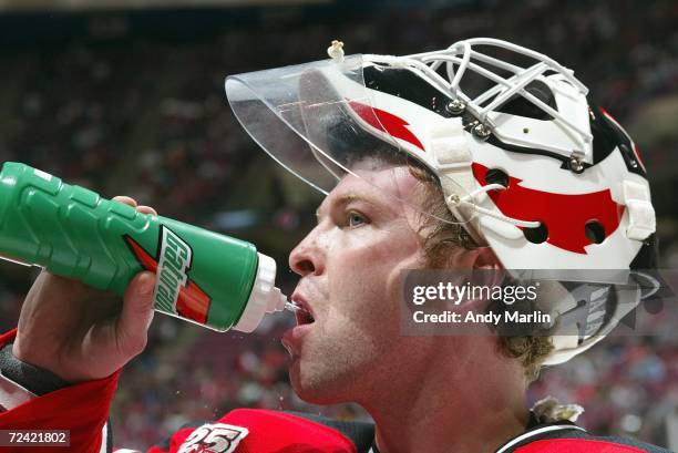 Goaltender Martin Brodeur of the New Jersey Devils drinks during the game against the Columbus Blue Jackets at the Continental Airlines Arena on...