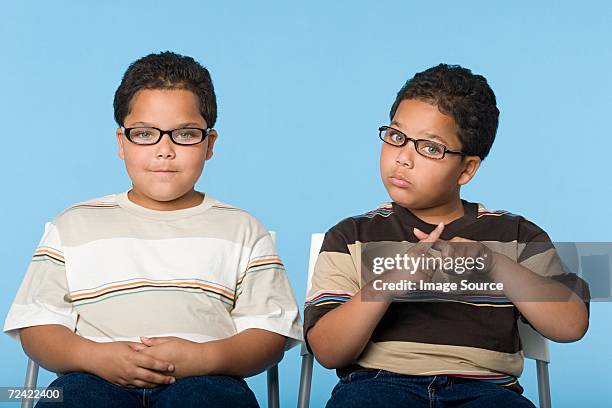 hispanic twin boys - identical twin stock pictures, royalty-free photos & images
