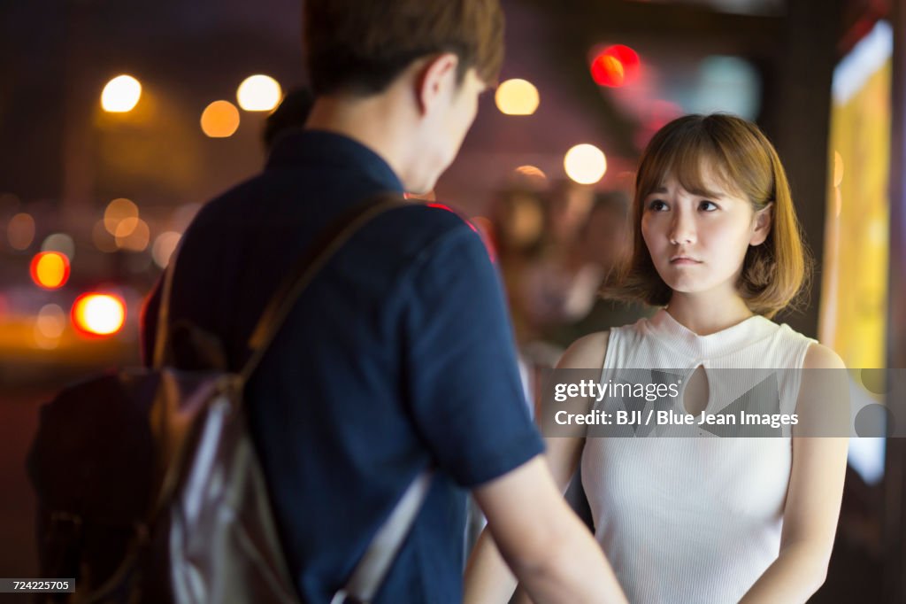 Young couple at the bus stop