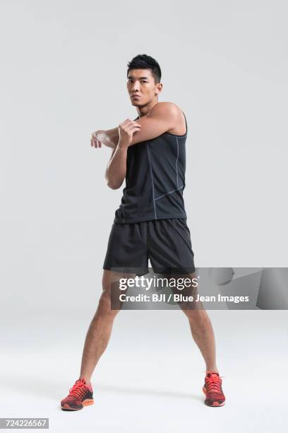 young man exercising - running shorts stock pictures, royalty-free photos & images