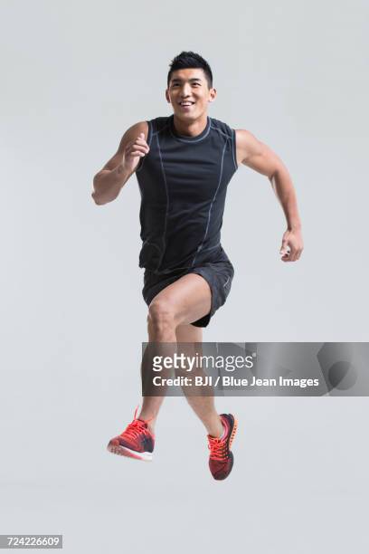 male athlete running - calções de corrida imagens e fotografias de stock