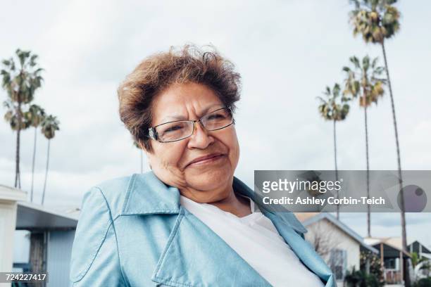 portrait of woman looking at camera smiling - anaheim - california ストックフォトと画像
