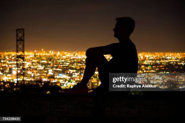 silhouette of jogger on bench looking away at view, runyon canyon, los angeles, california, usa - runyon canyon stock pictures, royalty-free photos & images