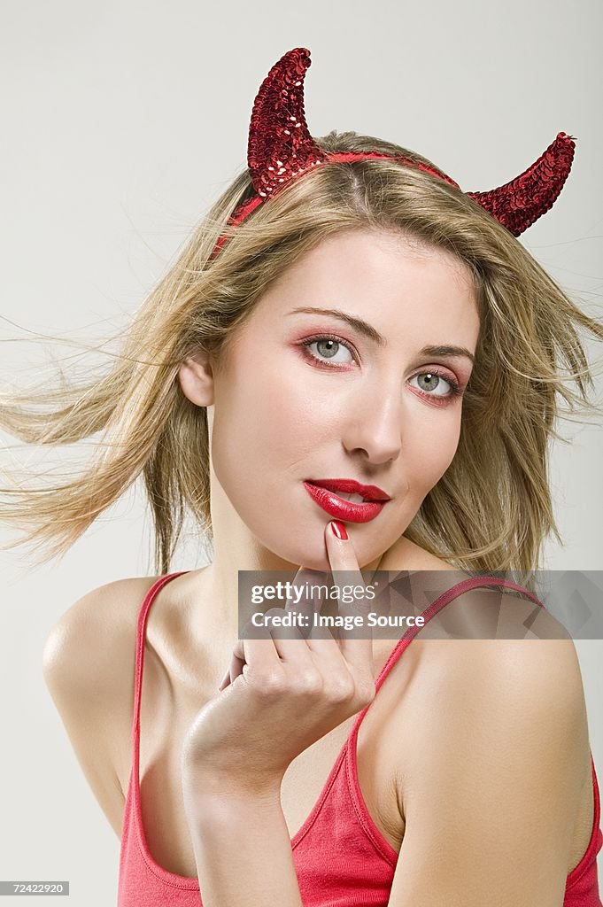 Woman wearing a devil costume