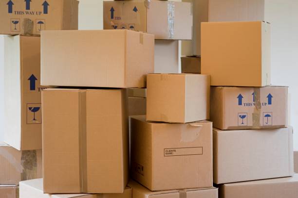 Where to Buy Moving Boxes in South Africa? 6 stack of cardboard boxes in a room