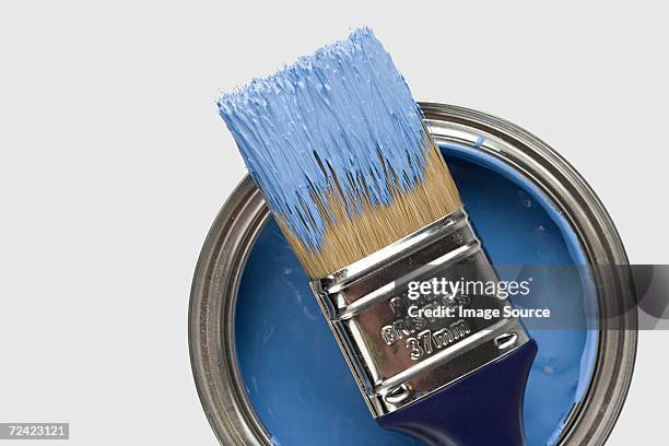 paintbrush and blue paint - ペンキ缶 ストックフォトと画像