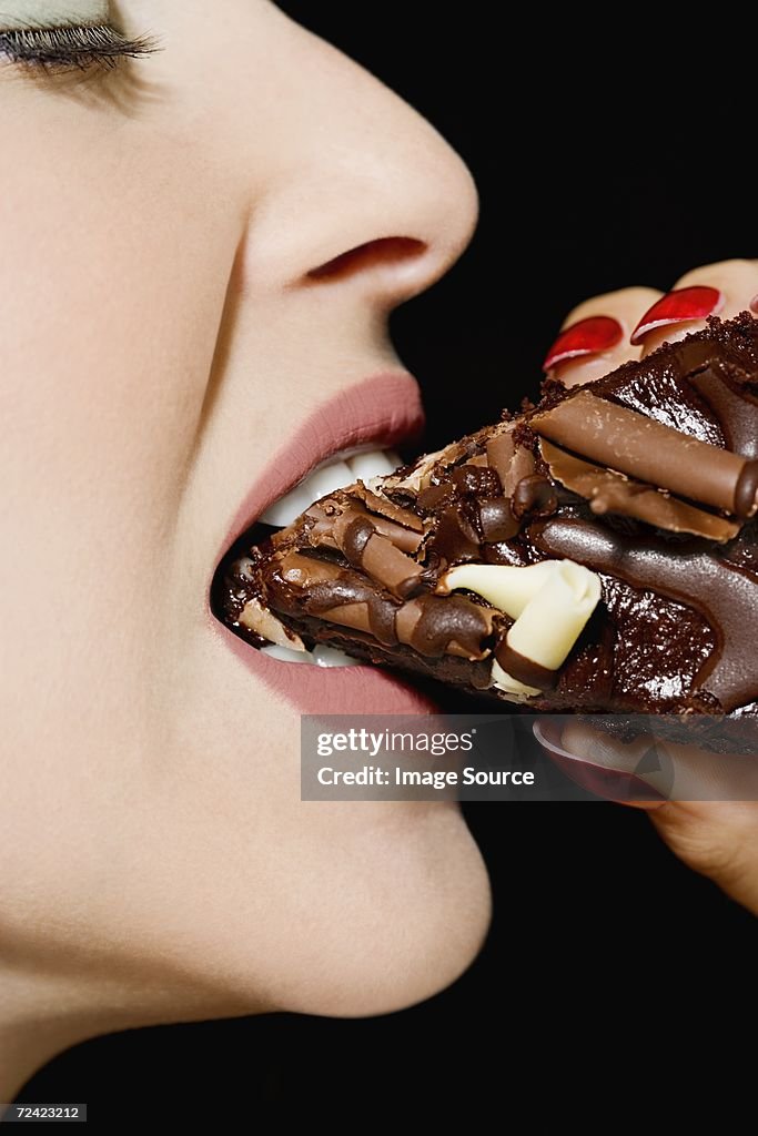 Woman eating chocolate cake