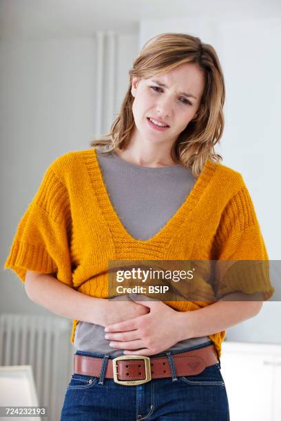 abdominal pain in a woman - bloating stock pictures, royalty-free photos & images