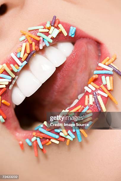 woman with sugar sprinkles on her lips - candy lips stock pictures, royalty-free photos & images