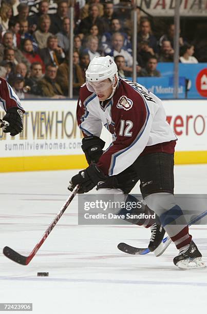 Brad Richardson of the Colorado Avalanche handles the puck against the Toronto Maple Leafs at Air Canada Centre on October 18, 2006 in Toronto,...