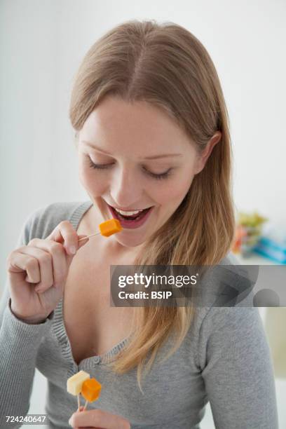 adolescent snacking - mimolette stock-fotos und bilder