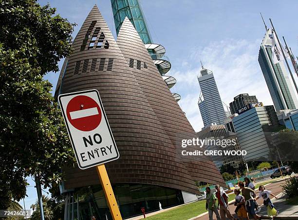 Family passes by the Swan Bell Tower tourist complex , with the Perth city skyline , 15 October 2006. A surprise federal court decision in September...