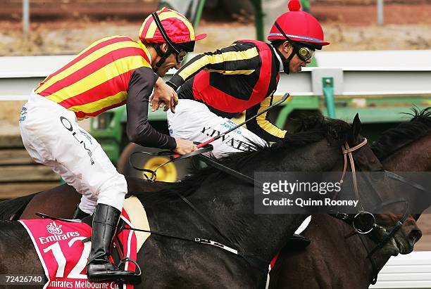Yasunari Iwata riding Delta Blues is congratulated by Damien Oliver riding Pop Rock after winning the Emirates Melbourne Cup during The Melbourne Cup...