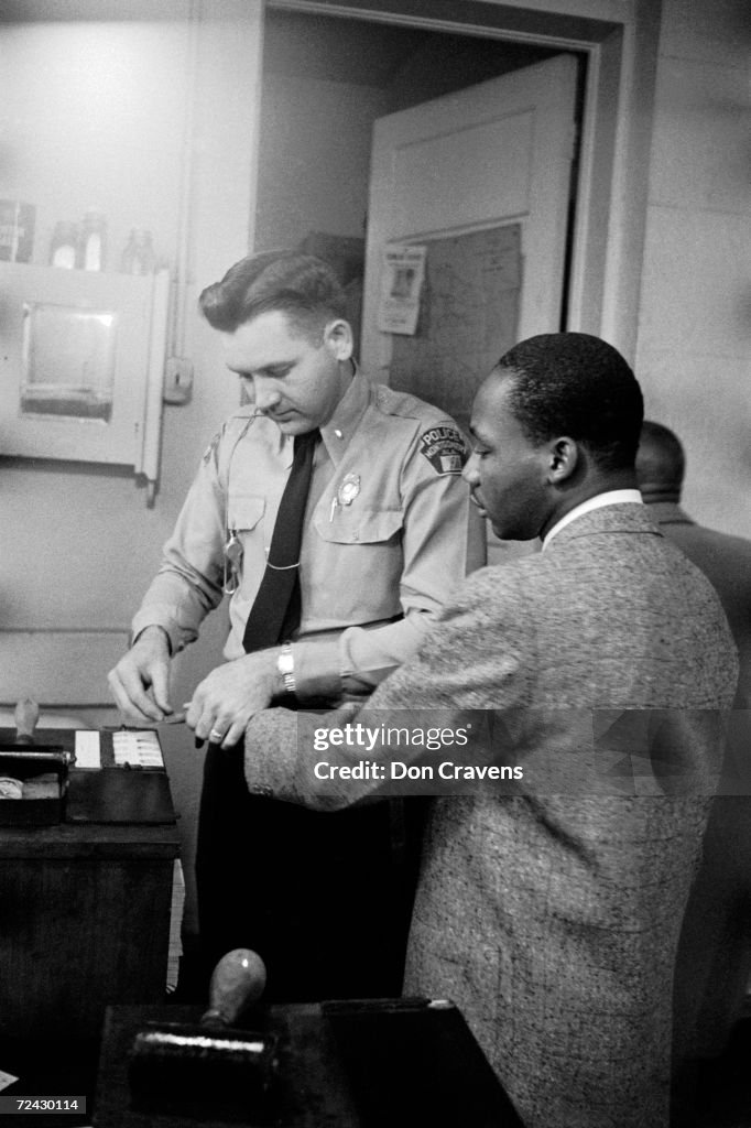 Civil rights leader Martin Luther King Jr being fingerprint