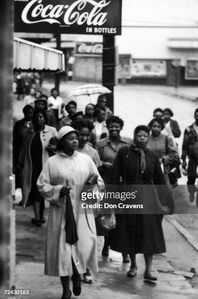 African American citizens walking to work and/or shopping during the bus boycott in Montgomery.