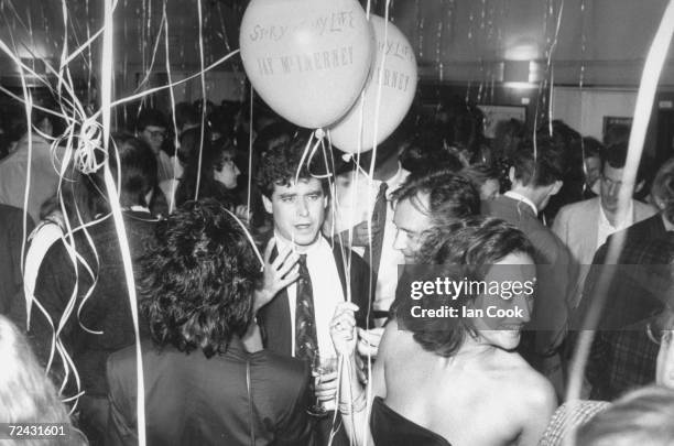 American novelist, Jay McInerney with "Private Eye" publicist Caroline Michel at book party thrown for him at disco "Grouchos.".