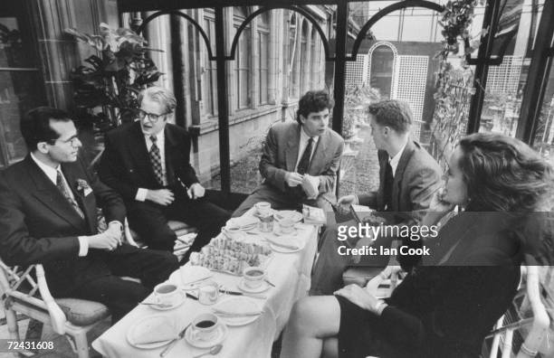 American novelist, Jay McInerney having afternoon tea with reporters from "Private Eye" and publicist Caroline Michel .