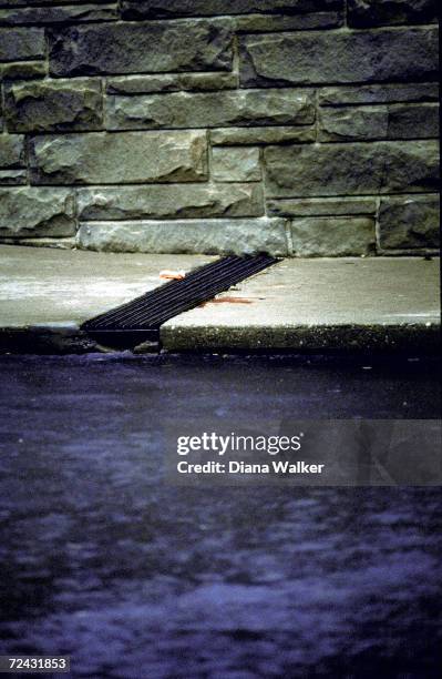 Bloodstain on sidewalk outside Washington Hilton Hotel where the assassination attemp on Ronald Reagan took place.