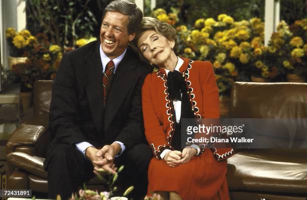 First Lady Nancy Reagan leaning up against TV show host David Hartman during "Good Morning America" interviewith.