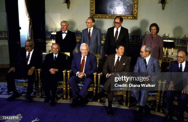 President Ronald Reagan posing for portrait with Supreme Court Justices Blackmun, Brennan, Burger, Marshall, O'Connor, Powell, Rehnquist, Stevens &...