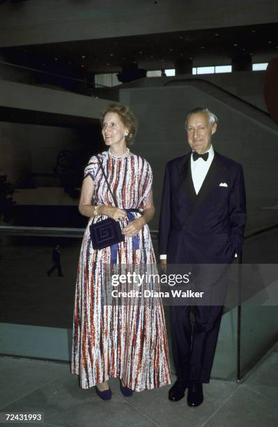 Paul Mellon and wife dressed in formal attire, hosting gala opening of East Building of National Gallery.