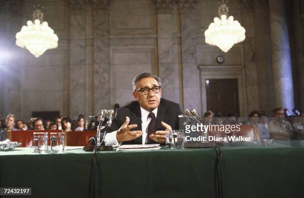 Former US Secretary of State Henry Kissinger testifying before Senate Energy Committee.