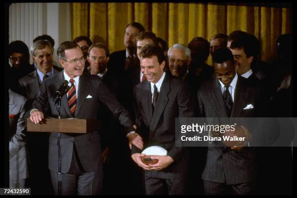 President George Bush at WH, feting Superbowl champs, SF Forty Niners, withquarterback Joe Montana.